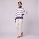 Nova snowflake knit sweater in navy blue, three-quarter view showing the fair-isle pattern