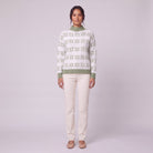 Nova snowflake knit sweater in sage green, front view on model