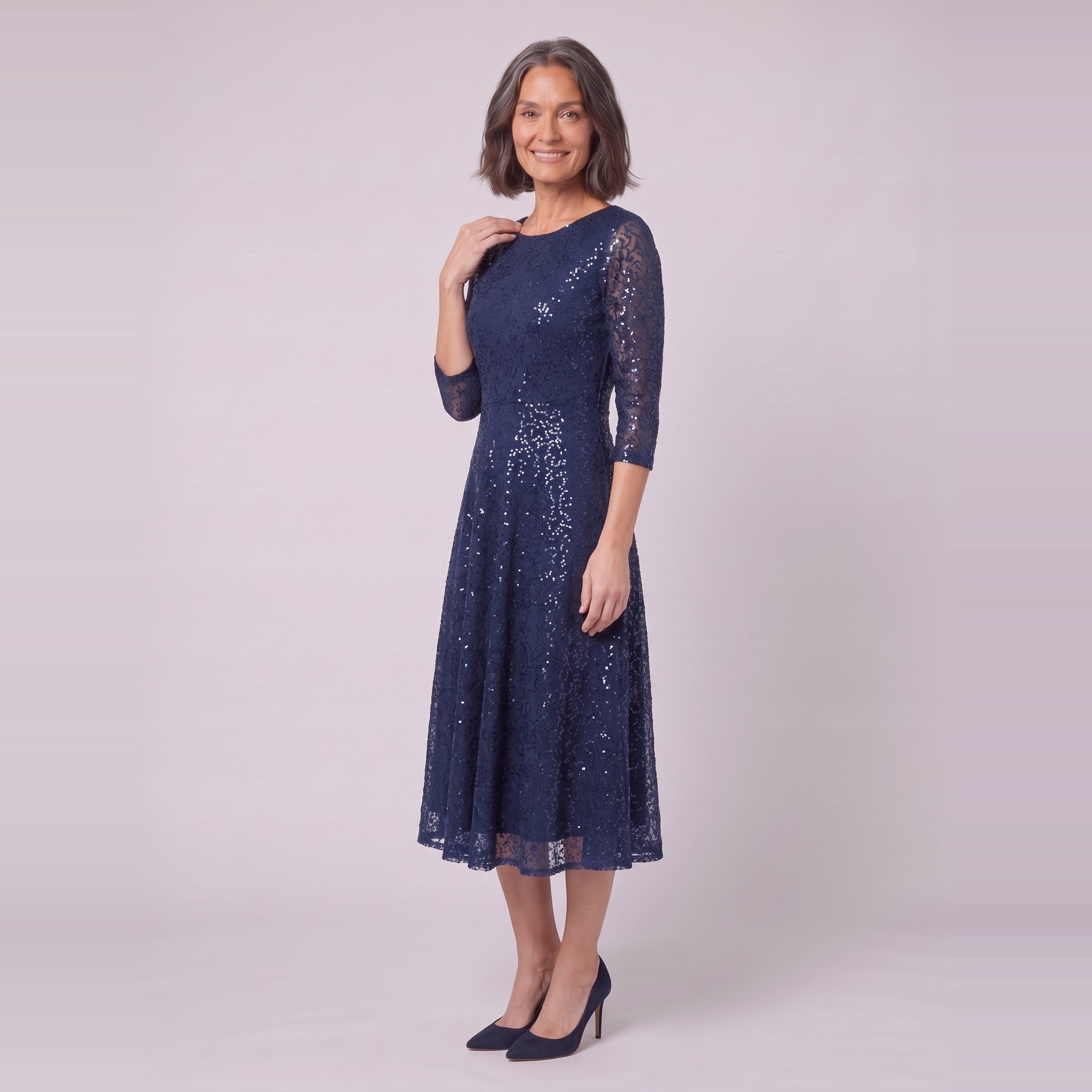 Novara navy sequin dress, three-quarter view showing the flared skirt