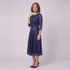 Novara navy sequin dress, three-quarter view showing the flared skirt