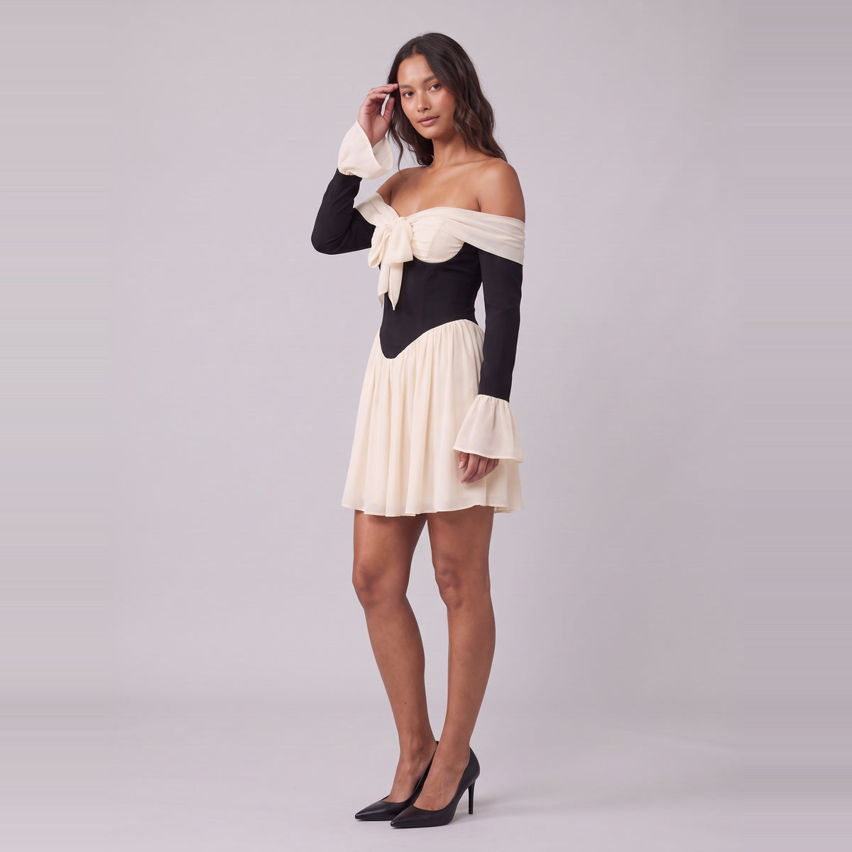 Odette corset mini dress, three-quarter view showing the gathered skirt