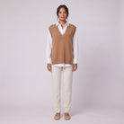 Roxane knit vest in camel brown, front view layered over a white shirt