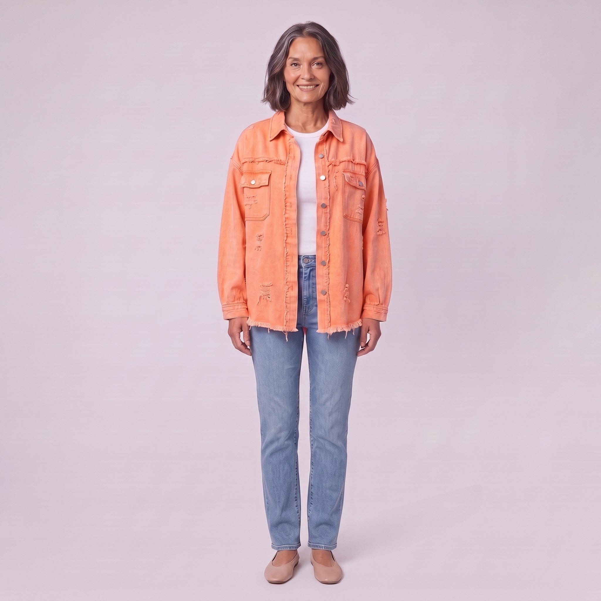 Saoirse distressed denim shacket in coral orange, front view on model