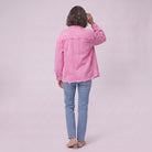 Saoirse denim shacket in pink, back view showing the raw frayed hem