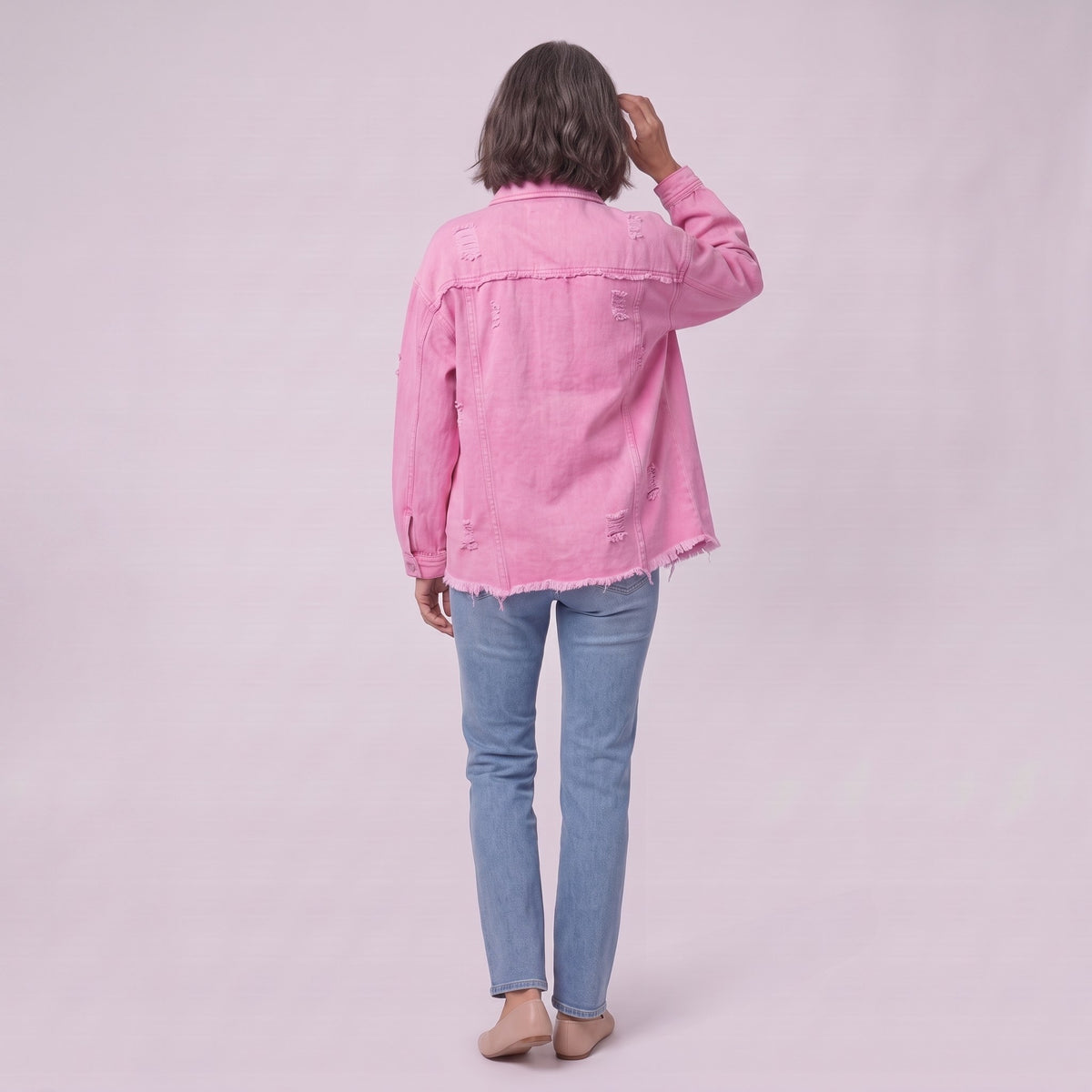 Saoirse denim shacket in pink, back view showing the raw frayed hem