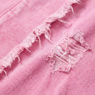 Saoirse denim shacket, close-up of the pink washed denim with frayed distressing