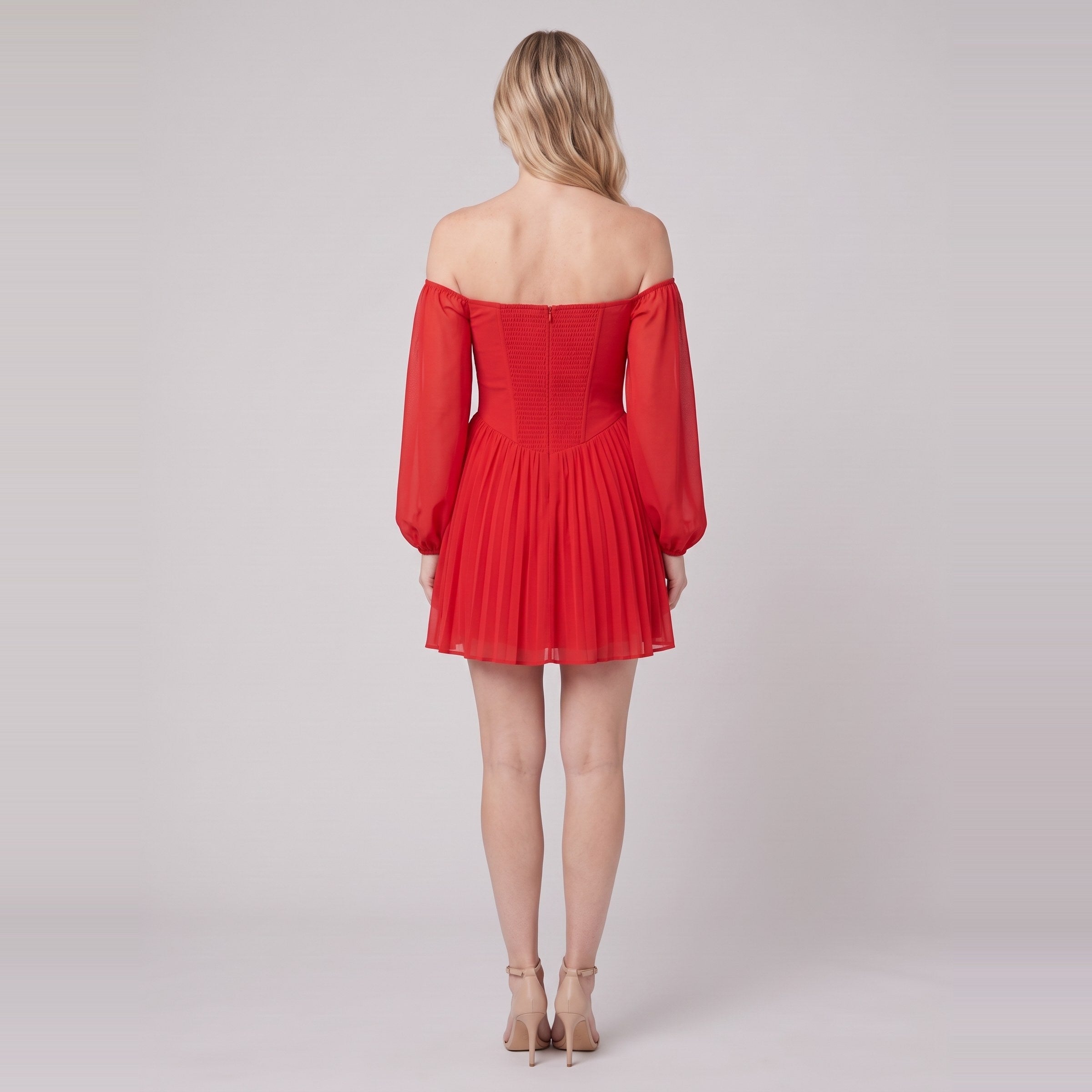 Scarlet Muse red mini dress seen from behind, showing the shirred back