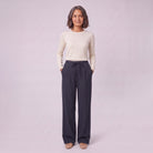 Sidony pinstripe wide leg trousers in navy blue, full-length view with hands in the pockets
