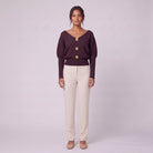 Solenne boat neck sweater with gold buttons in deep burgundy red, front view on model