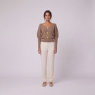 Solenne boat neck sweater with gold buttons in beige taupe, front view on model