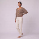 Solenne boat neck sweater in beige taupe, three quarter view showing dolman sleeves