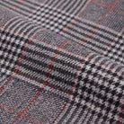 Sunniva check trousers fabric detail, Prince of Wales glen check weave with red overcheck close-up