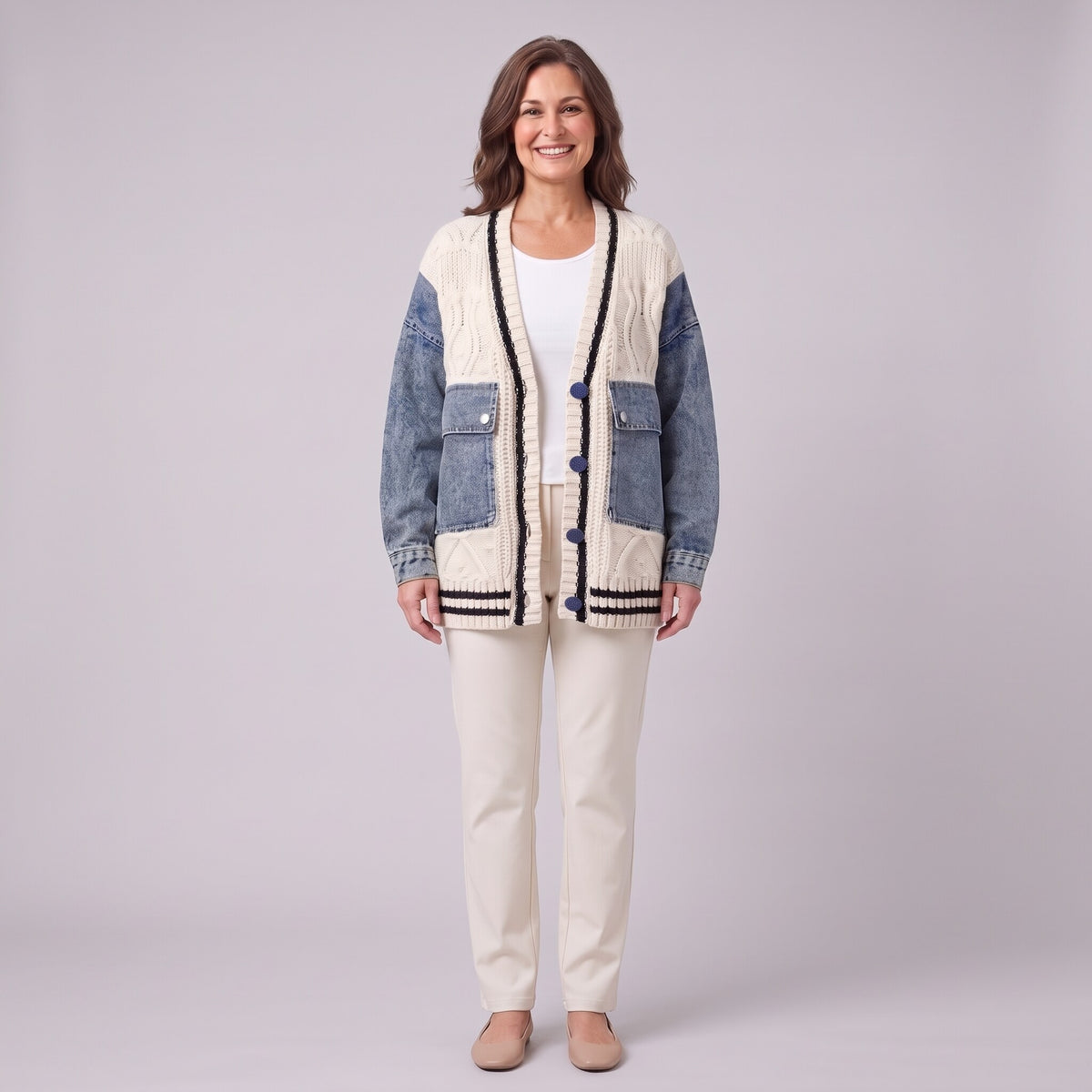 Tamsin denim sleeve cable knit cardigan in white, front view on model with cream trousers