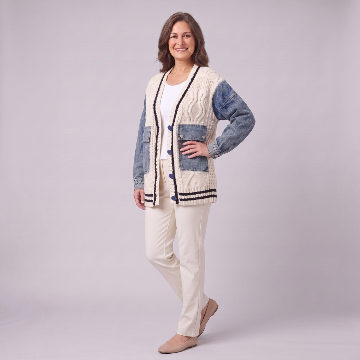 Tamsin denim sleeve cable knit cardigan in white, three quarter view showing denim patch pockets
