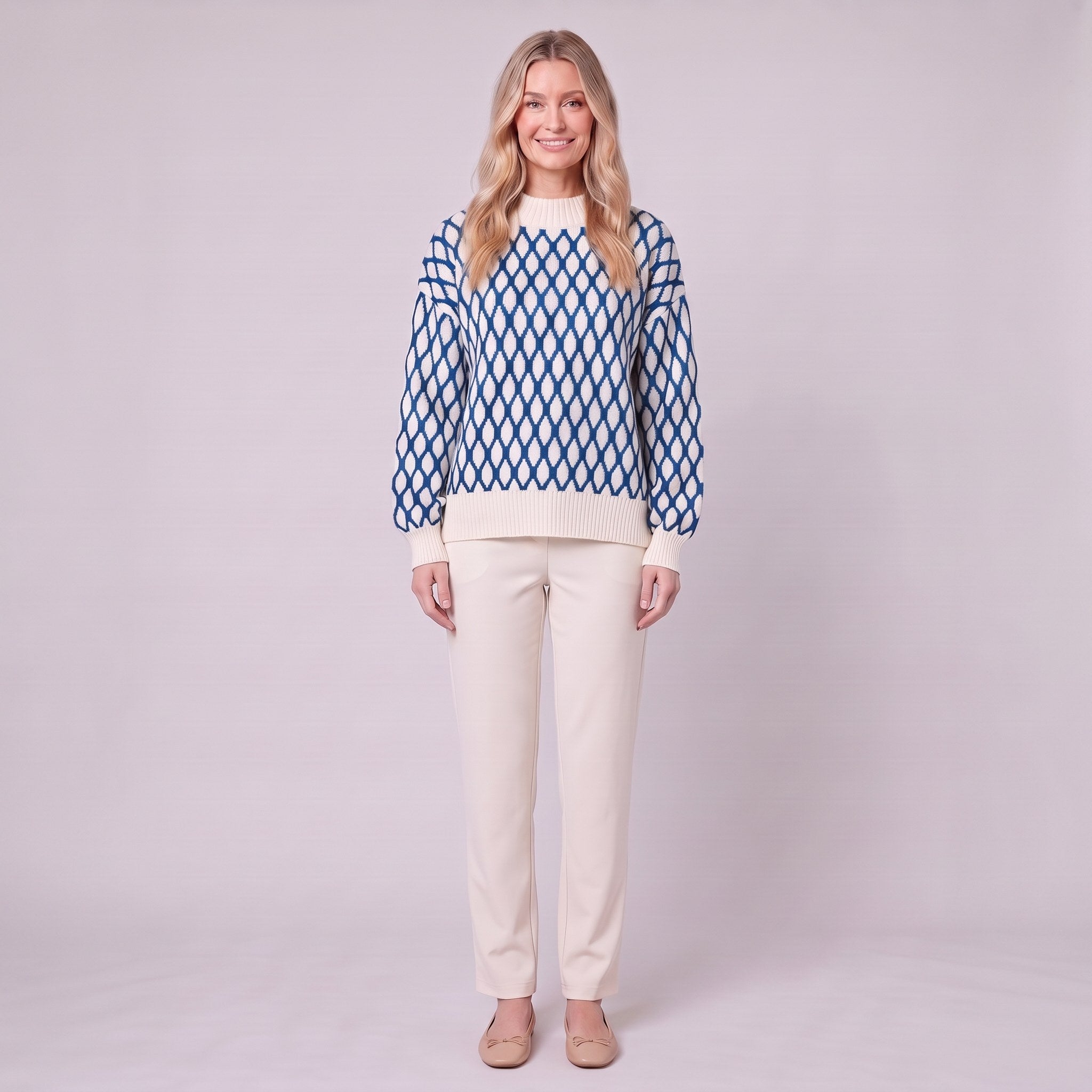Zinnia lattice knit sweater in cream and cobalt blue, front view on model