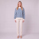 Zinnia lattice knit sweater in cream and cobalt blue, front view on model