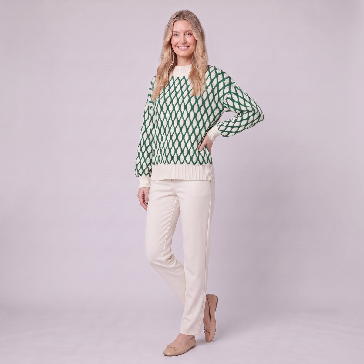 Zinnia lattice knit sweater in emerald green, three-quarter view showing the mock neck