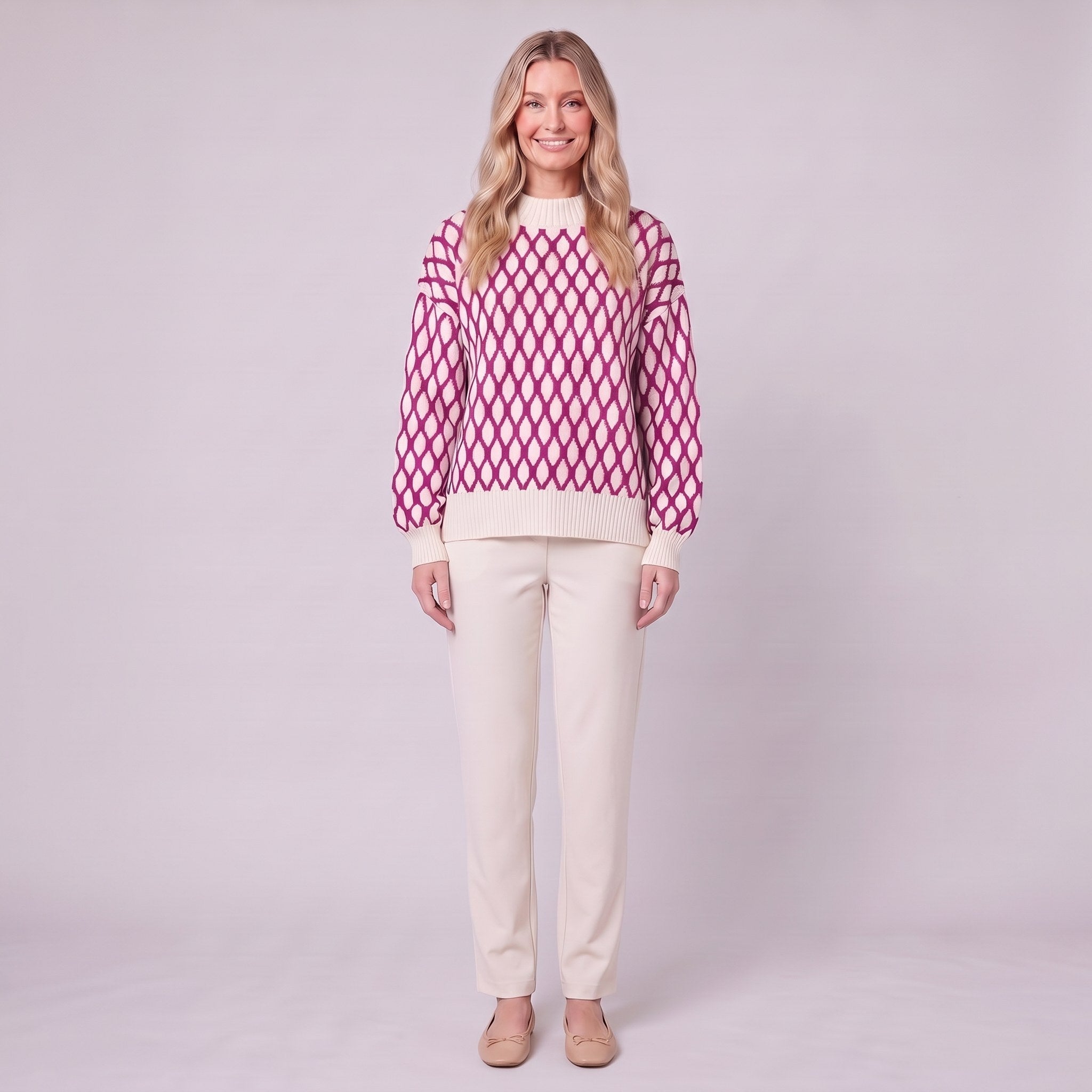 Zinnia lattice knit sweater in cream and fuchsia pink, front view on model