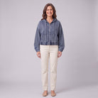 Zosia cropped denim hoodie in slate blue, zip front, front view on model
