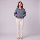 Zosia cropped denim hoodie in slate blue, full-length view with hands in pockets