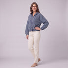Zosia cropped denim hoodie in slate blue, three-quarter view showing cropped boxy fit
