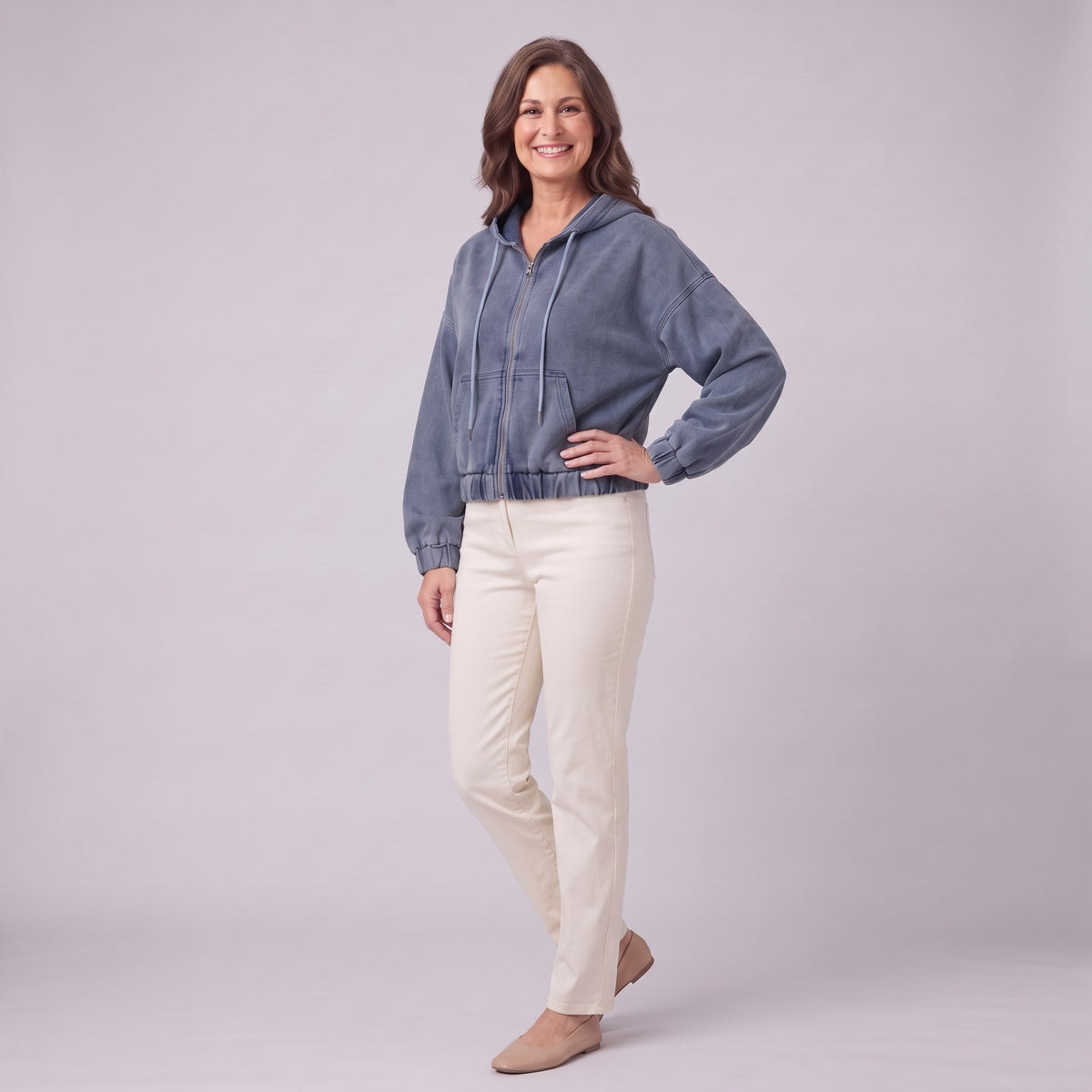 Zosia cropped denim hoodie in slate blue, three-quarter view showing cropped boxy fit