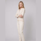 Romy wool-blend button cardigan in cream on model