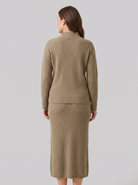 Soraya knit sweater and skirt set in taupe, back view on model