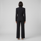Wanda tailored suit in black, back view on model