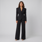 Wanda tailored peak lapel suit in black on model
